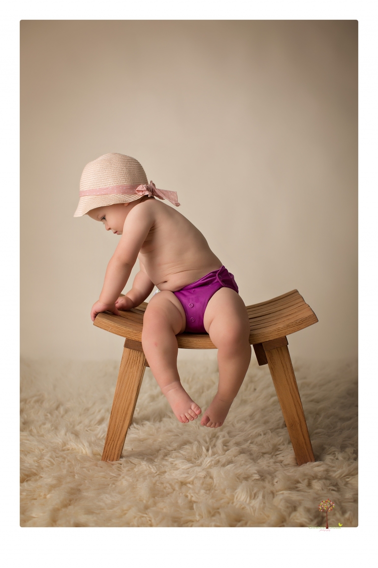 Sonora Baby Photographer Christine Dibble Photography photographs a first birthday session of a girl wearing a flower girl dress made from her mother's wedding dress.