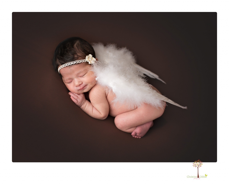 Sonora Newborn Photographer Christine Dibble Photography takes studio newborn portraits of babies using vintage props and linens.