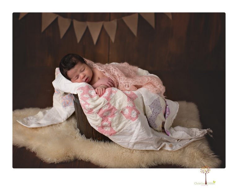 Sonora Newborn Photographer Christine Dibble Photography takes studio newborn portraits of babies using vintage props and linens.