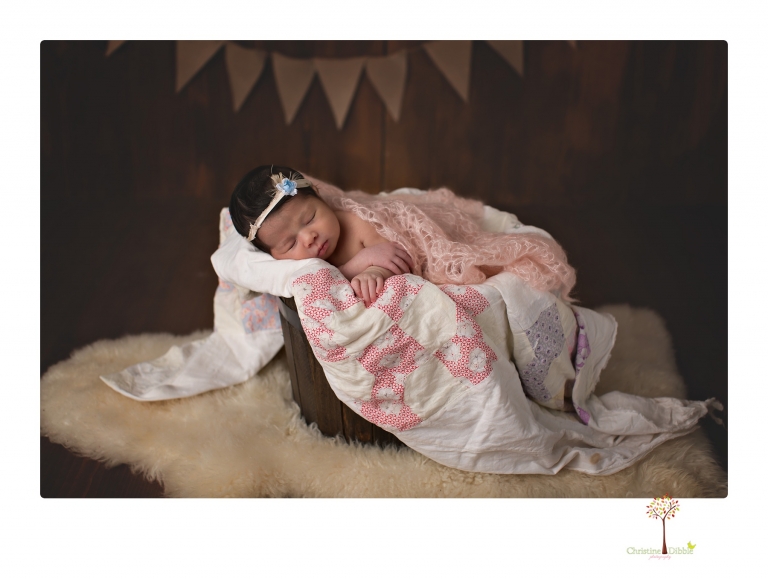 Sonora Newborn Photographer Christine Dibble Photography takes studio newborn portraits of babies using vintage props and linens.