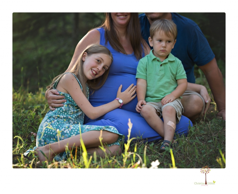 Sonora maternity photographer Christine Dibble Photography takes Long Barn maternity portraits in a field and woods of a mother-to-be and her family.