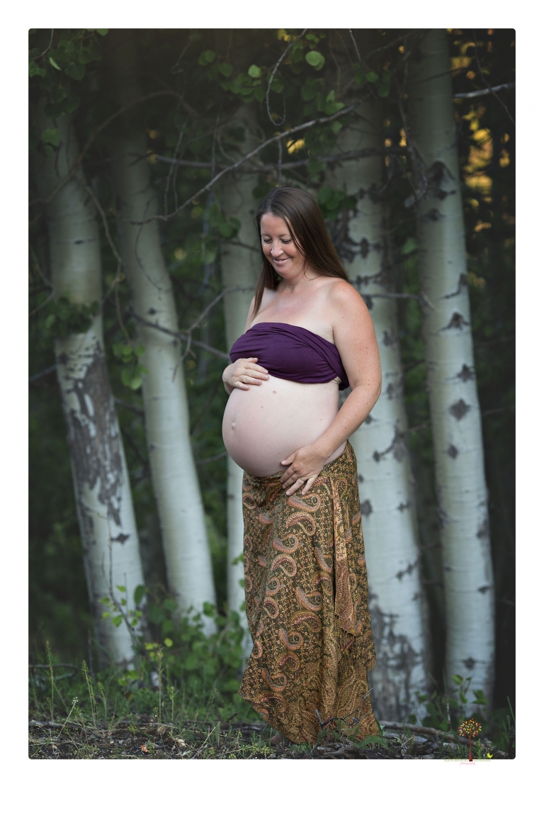 Sonora maternity photographer Christine Dibble Photography takes Long Barn maternity portraits in a field and woods of a mother-to-be and her family.