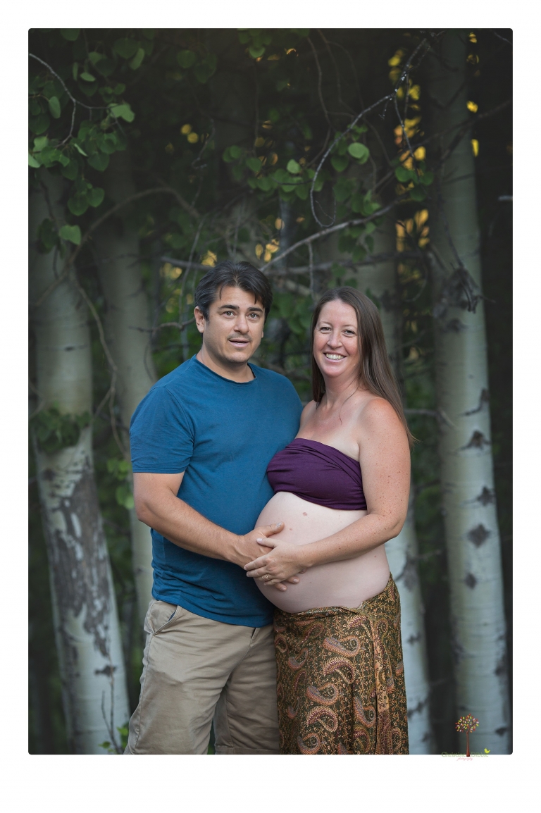 Sonora maternity photographer Christine Dibble Photography takes Long Barn maternity portraits in a field and woods of a mother-to-be and her family.