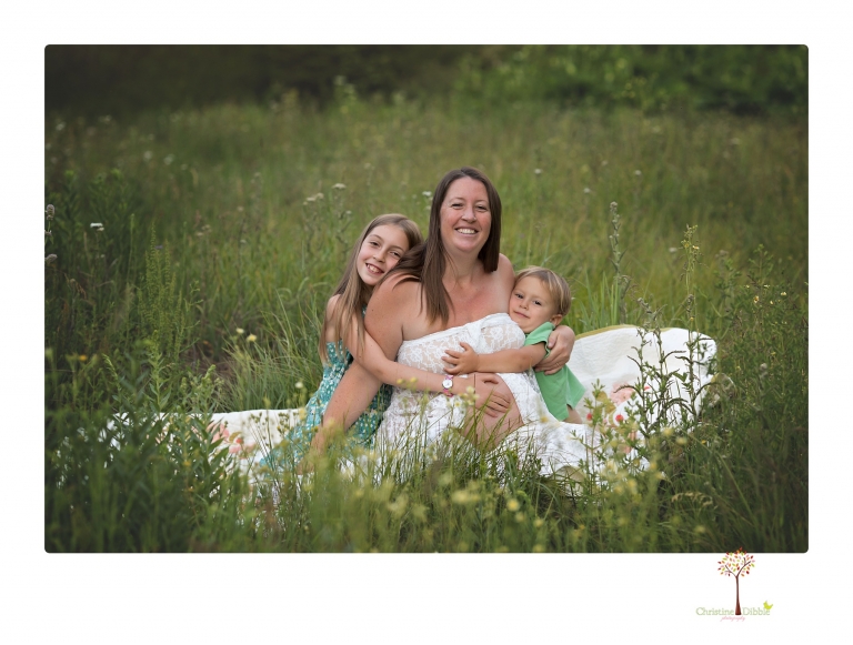 Sonora maternity photographer Christine Dibble Photography takes Long Barn maternity portraits in a field and woods of a mother-to-be and her family.