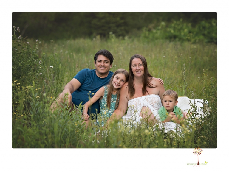 Sonora maternity photographer Christine Dibble Photography takes Long Barn maternity portraits in a field and woods of a mother-to-be and her family.
