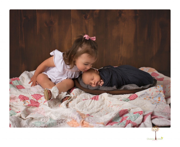 Sonora newborn photographer Christine Dibble Photography takes older newborn portraits of a baby boy with his big sister and mother.