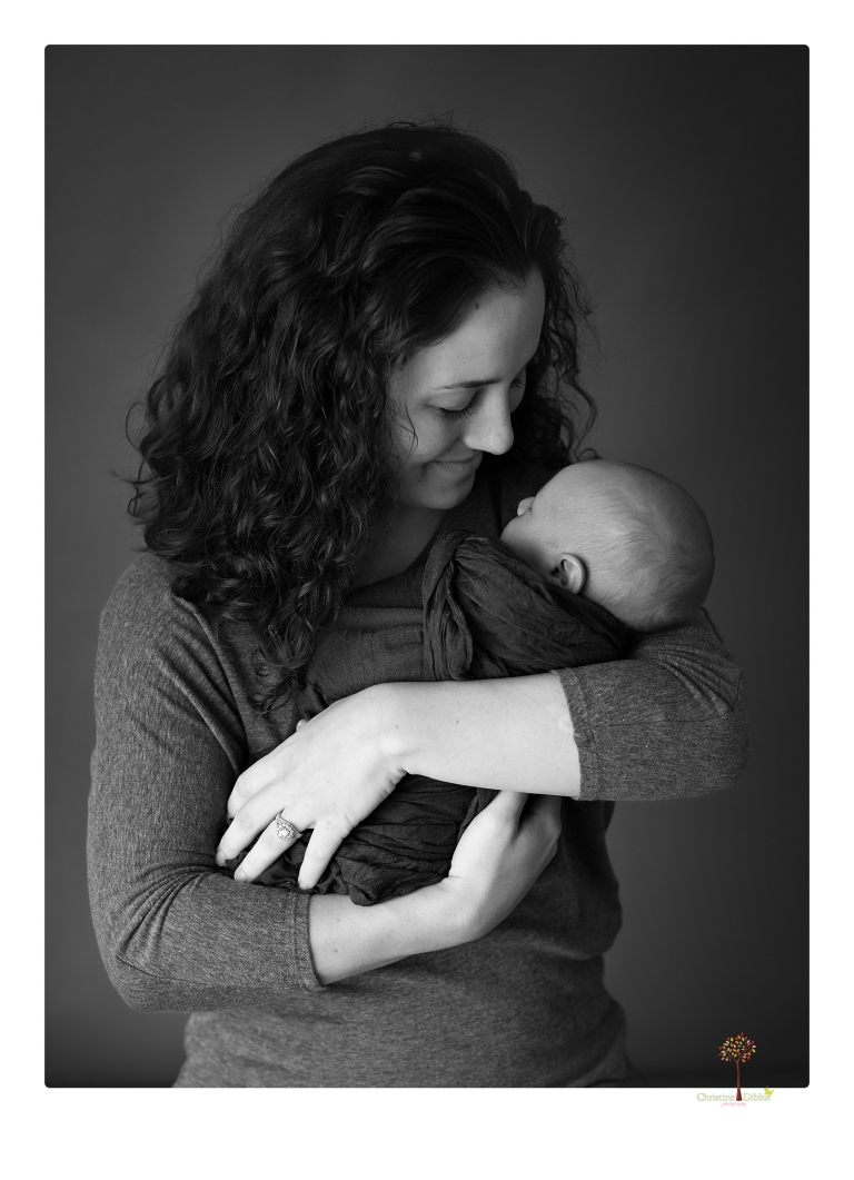 Sonora newborn photographer Christine Dibble Photography takes older newborn portraits of a baby boy with his big sister and mother.