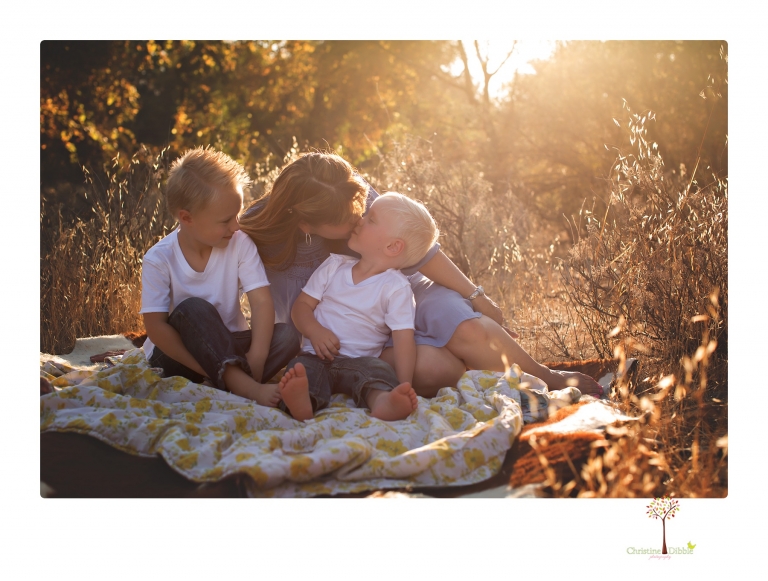 Sonora maternity photographer Christine Dibble Photography takes unique maternity portraits in the river at Knights Ferry of a family and mother of three.