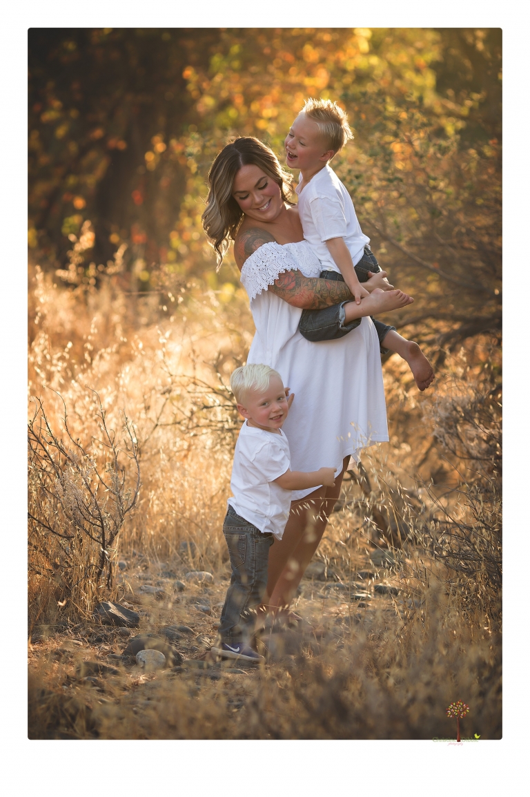 Sonora maternity photographer Christine Dibble Photography takes unique maternity portraits in the river at Knights Ferry of a family and mother of three.
