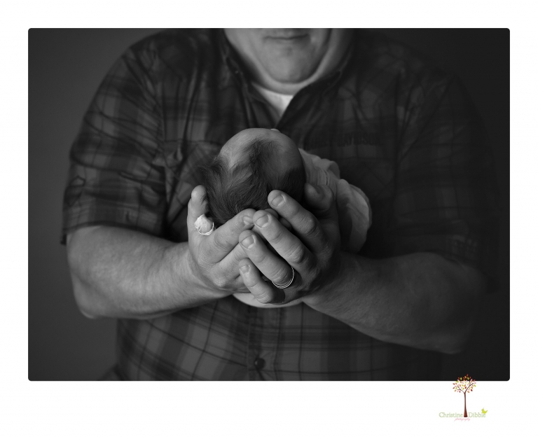 Sonora newborn photographer Christine Dibble Photography takes newborn portraits of a future Harley Davidson fan and his parents.