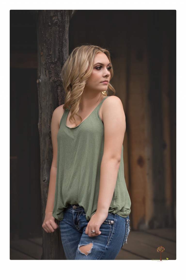 Sonora senior portrait photographer Christine Dibble Photography takes senior portraits of a Summerville High School graduate in Long Barn with her boyfriend.