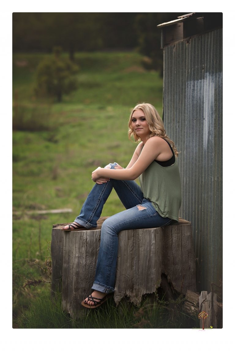 Sonora senior portrait photographer Christine Dibble Photography takes senior portraits of a Summerville High School graduate in Long Barn with her boyfriend.