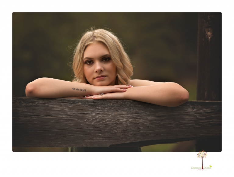 Sonora senior portrait photographer Christine Dibble Photography takes senior portraits of a Summerville High School graduate in Long Barn with her boyfriend.