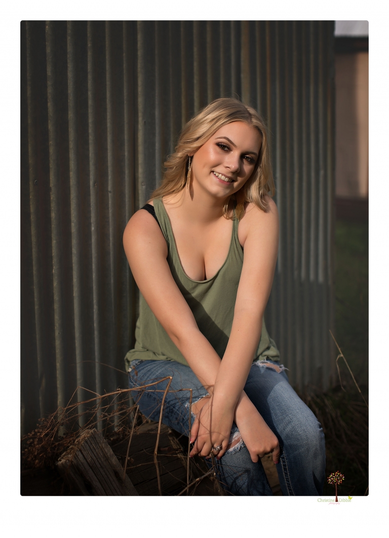 Sonora senior portrait photographer Christine Dibble Photography takes senior portraits of a Summerville High School graduate in Long Barn with her boyfriend.
