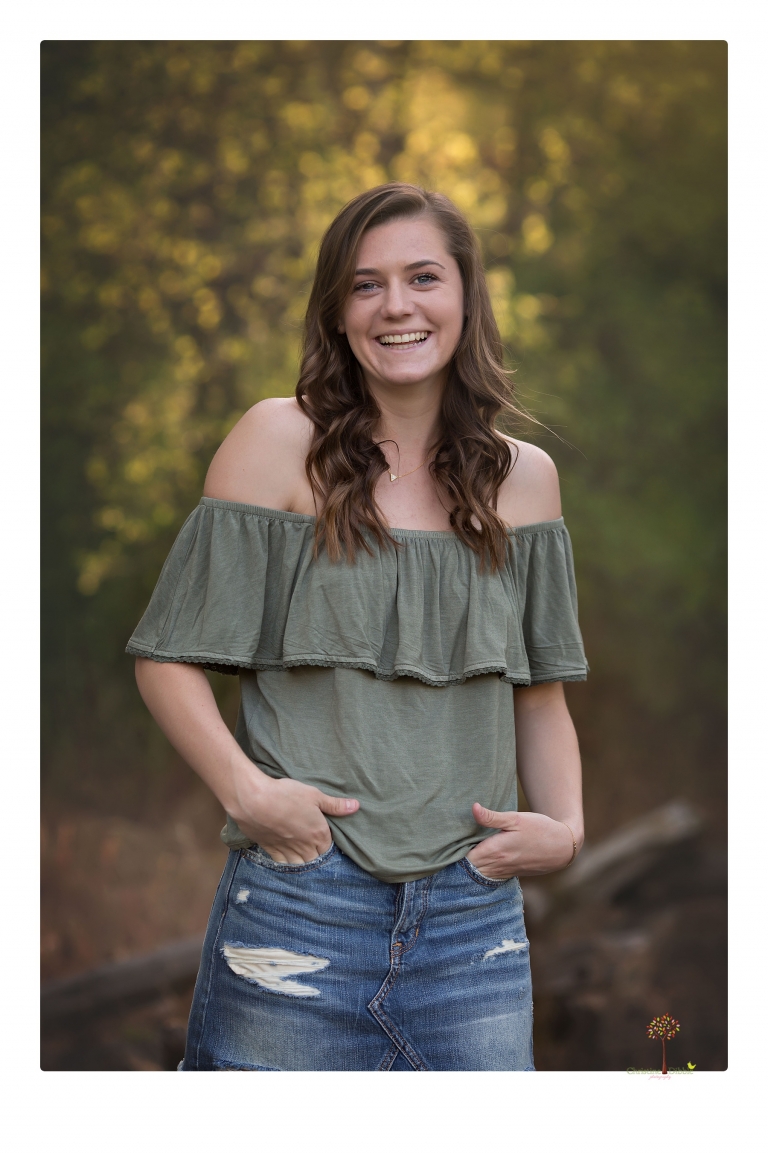 Sonora High School Senior Photographer Christine Dibble Photography photographs a senior portrait session at Indigeny Reserve of a girl among the apple trees and in the creek.