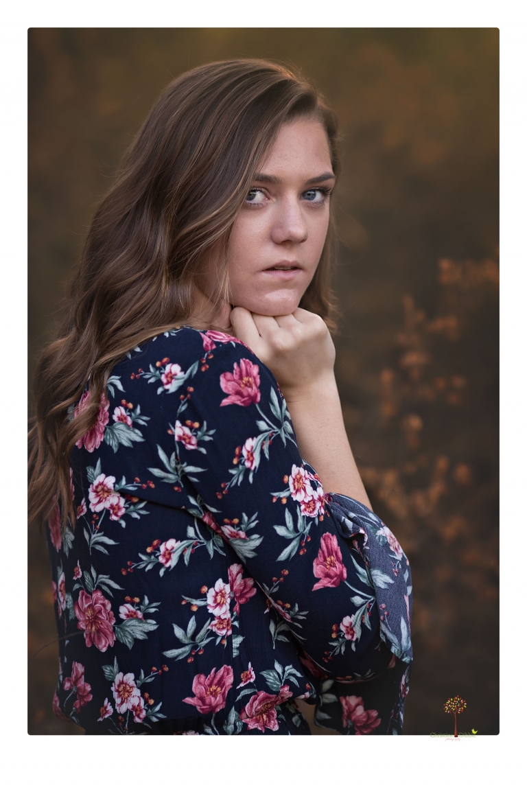 Sonora High School Senior Photographer Christine Dibble Photography photographs a senior portrait session at Indigeny Reserve of a girl among the apple trees and in the creek.