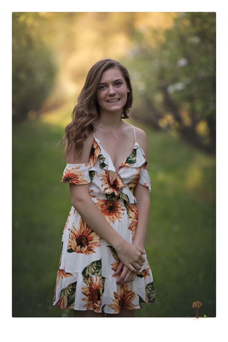 Sonora High School Senior Photographer Christine Dibble Photography photographs a senior portrait session at Indigeny Reserve of a girl among the apple trees and in the creek.