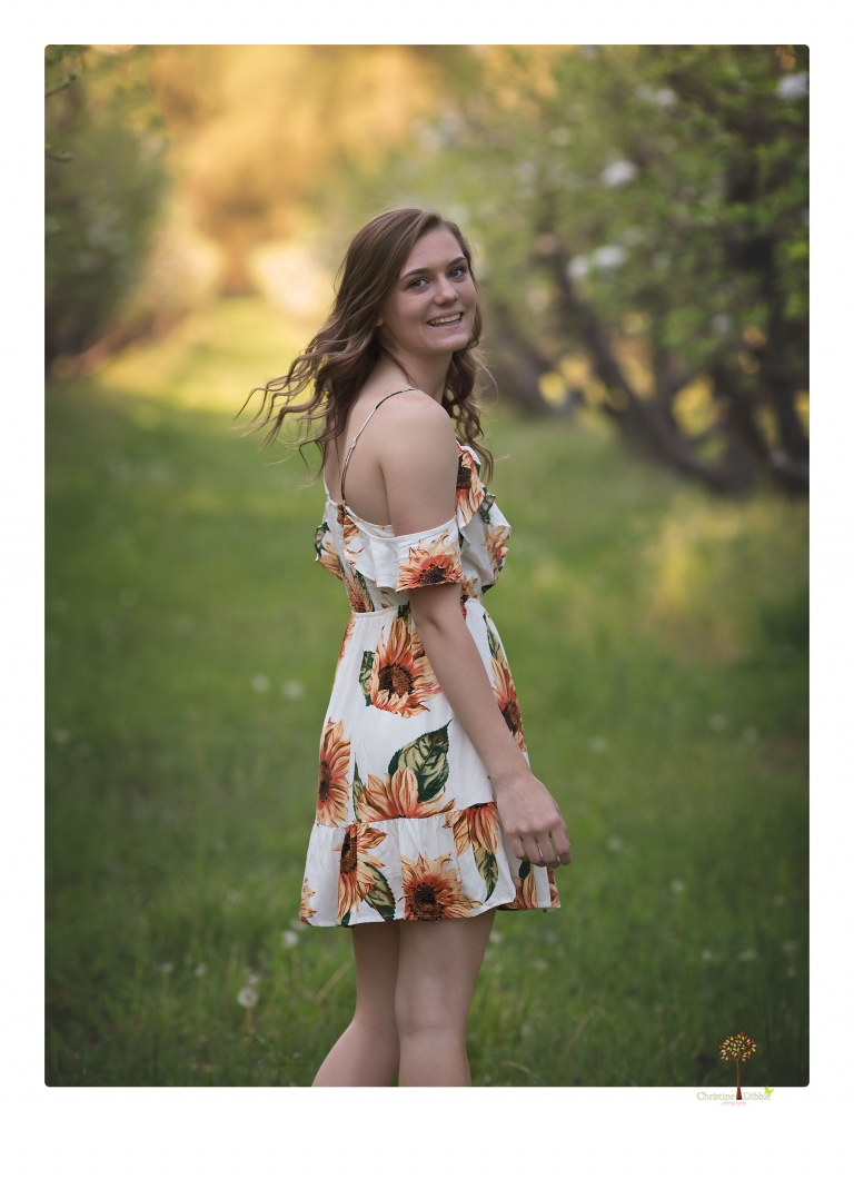 Sonora High School Senior Photographer Christine Dibble Photography photographs a senior portrait session at Indigeny Reserve of a girl among the apple trees and in the creek.