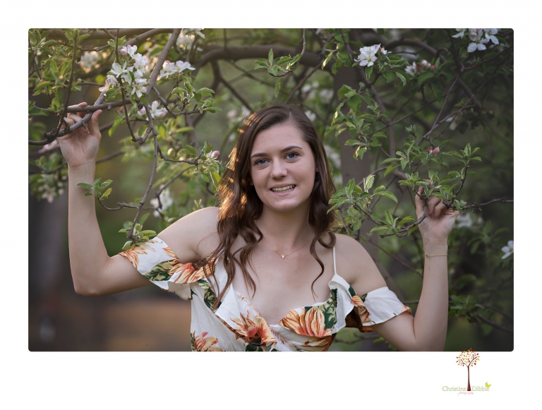 Sonora High School Senior Photographer Christine Dibble Photography photographs a senior portrait session at Indigeny Reserve of a girl among the apple trees and in the creek.