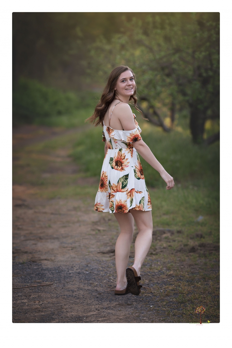 Sonora High School Senior Photographer Christine Dibble Photography photographs a senior portrait session at Indigeny Reserve of a girl among the apple trees and in the creek.