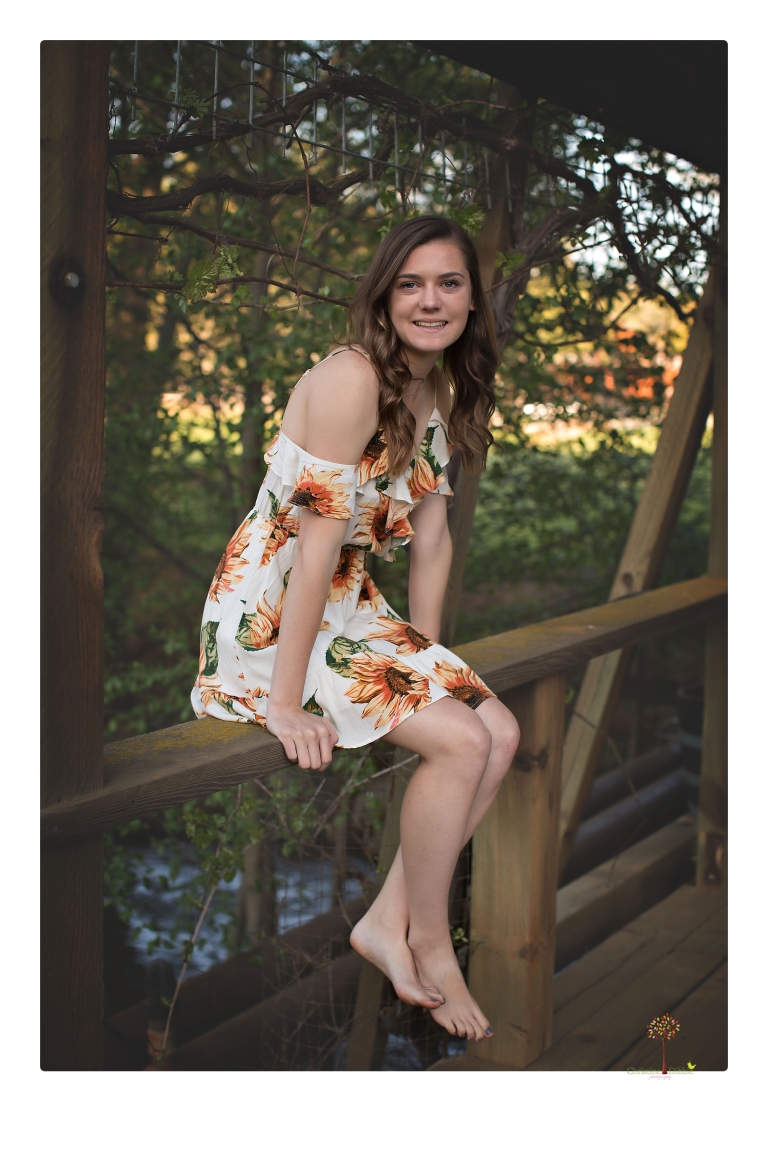 Sonora High School Senior Photographer Christine Dibble Photography photographs a senior portrait session at Indigeny Reserve of a girl among the apple trees and in the creek.