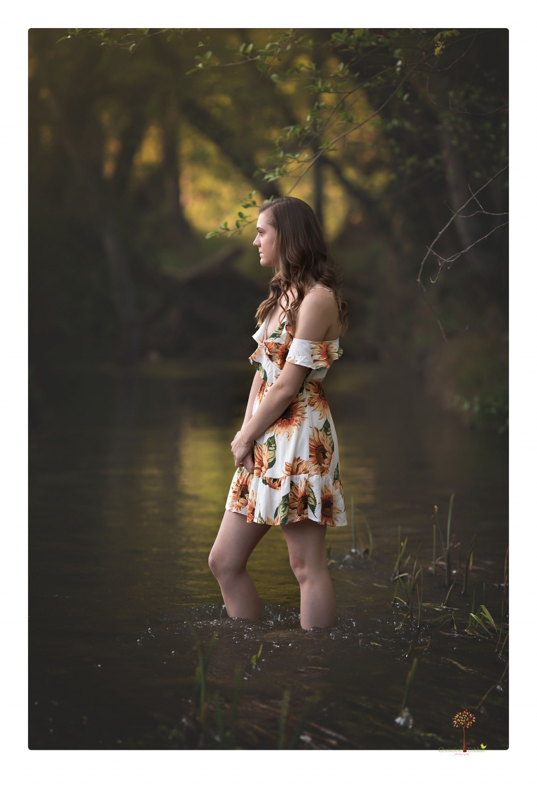 Sonora High School Senior Photographer Christine Dibble Photography photographs a senior portrait session at Indigeny Reserve of a girl among the apple trees and in the creek.
