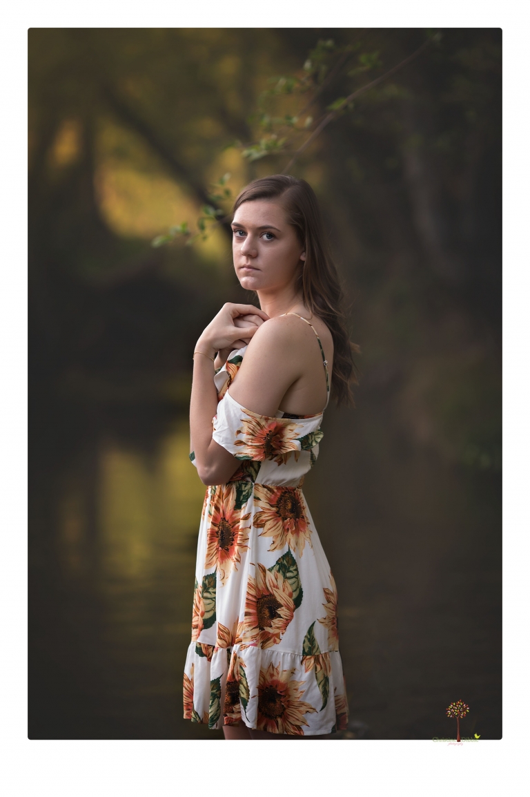 Sonora High School Senior Photographer Christine Dibble Photography photographs a senior portrait session at Indigeny Reserve of a girl among the apple trees and in the creek.