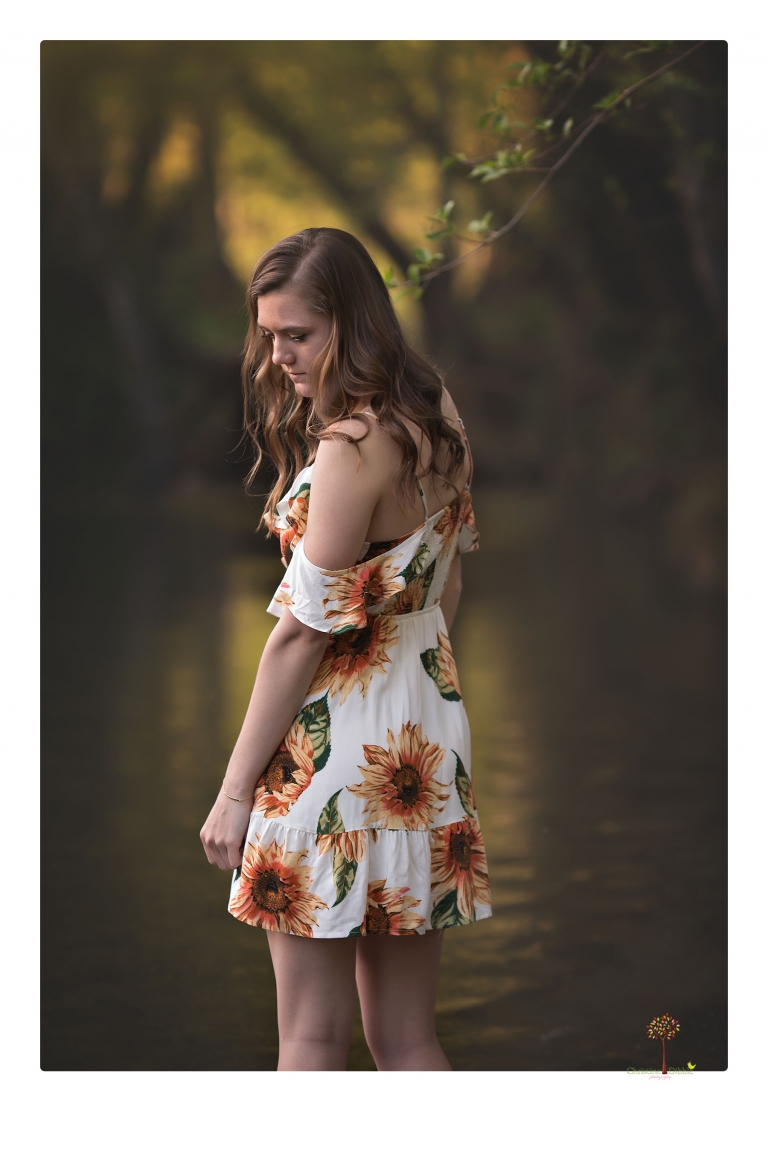 Sonora High School Senior Photographer Christine Dibble Photography photographs a senior portrait session at Indigeny Reserve of a girl among the apple trees and in the creek.