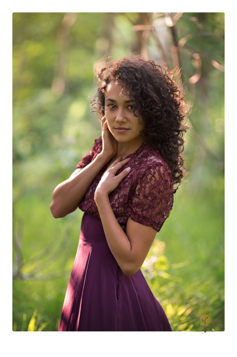 Sonora photographer Christine Dibble Photography takes portraits of a senior in Mammoth Lakes as she poses in a creek and meadow in thrift shop dresses.