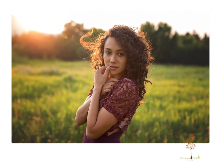 Sonora photographer Christine Dibble Photography takes portraits of a senior in Mammoth Lakes as she poses in a creek and meadow in thrift shop dresses.