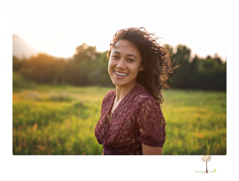 Sonora photographer Christine Dibble Photography takes portraits of a senior in Mammoth Lakes as she poses in a creek and meadow in thrift shop dresses.