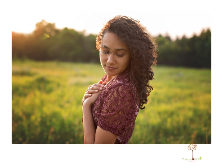 Sonora photographer Christine Dibble Photography takes portraits of a senior in Mammoth Lakes as she poses in a creek and meadow in thrift shop dresses.