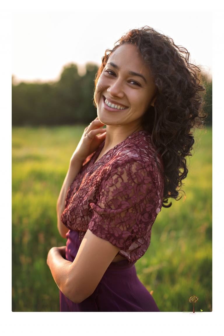 Sonora photographer Christine Dibble Photography takes portraits of a senior in Mammoth Lakes as she poses in a creek and meadow in thrift shop dresses.