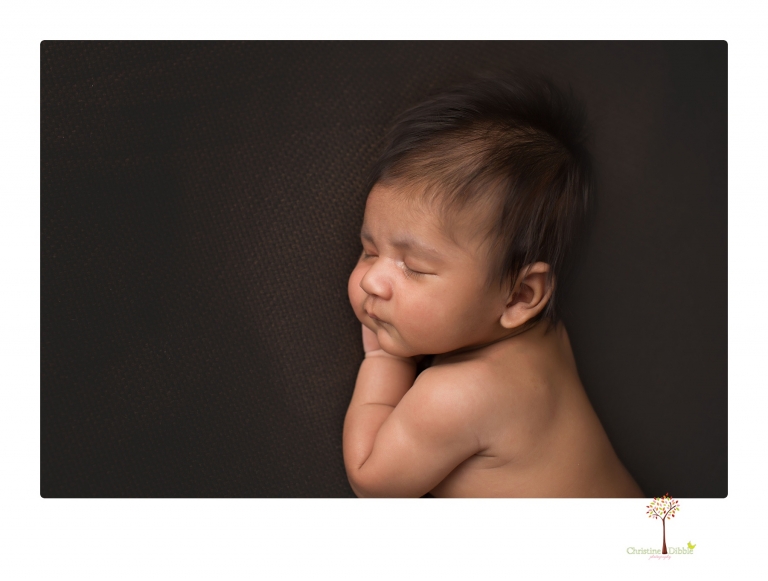 Sonora newborn photographer Christine Dibble Photography takes newborn family portraits of a baby boy and his parents and grandmother.