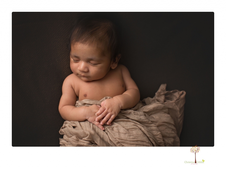 Sonora newborn photographer Christine Dibble Photography takes newborn family portraits of a baby boy and his parents and grandmother.