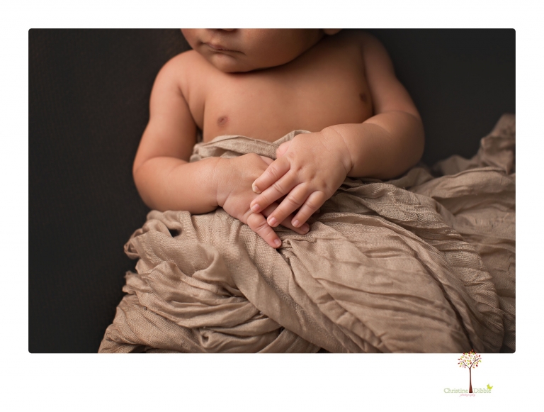 Sonora newborn photographer Christine Dibble Photography takes newborn family portraits of a baby boy and his parents and grandmother.