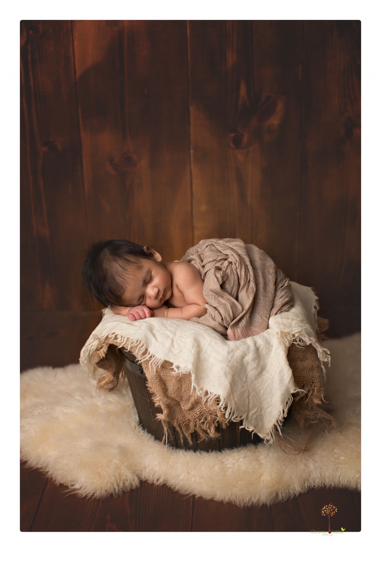 Sonora newborn photographer Christine Dibble Photography takes newborn family portraits of a baby boy and his parents and grandmother.