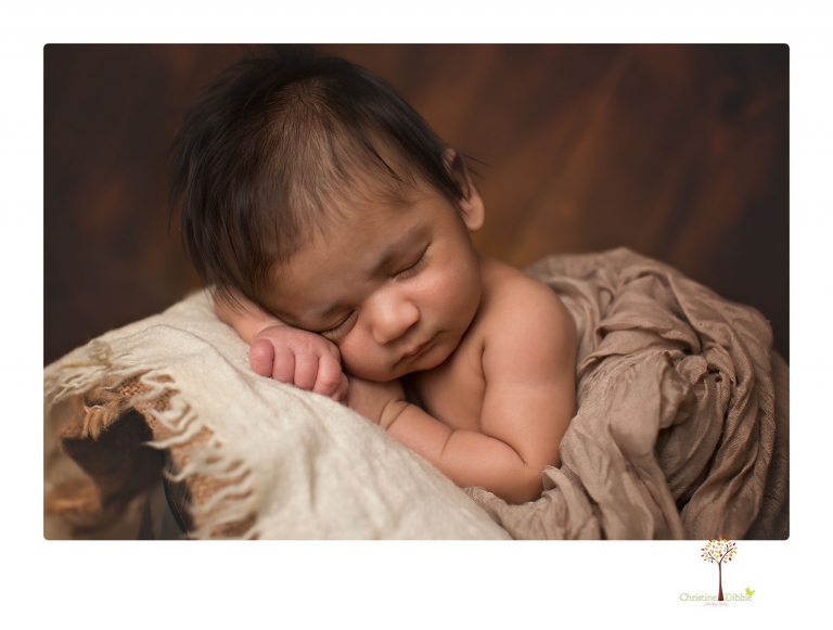 Sonora newborn photographer Christine Dibble Photography takes newborn family portraits of a baby boy and his parents and grandmother.