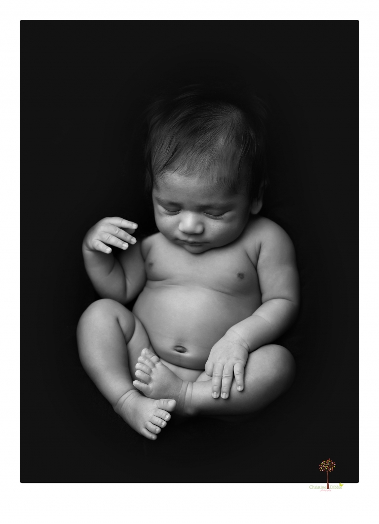 Sonora newborn photographer Christine Dibble Photography takes newborn family portraits of a baby boy and his parents and grandmother.