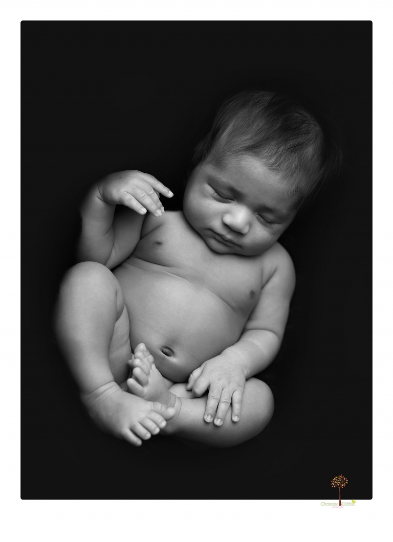 Sonora newborn photographer Christine Dibble Photography takes newborn family portraits of a baby boy and his parents and grandmother.