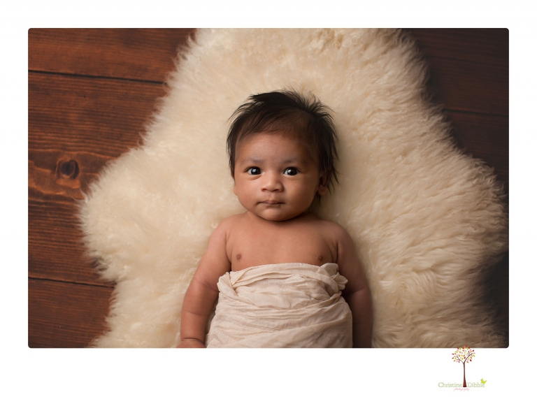 Sonora newborn photographer Christine Dibble Photography takes newborn family portraits of a baby boy and his parents and grandmother.