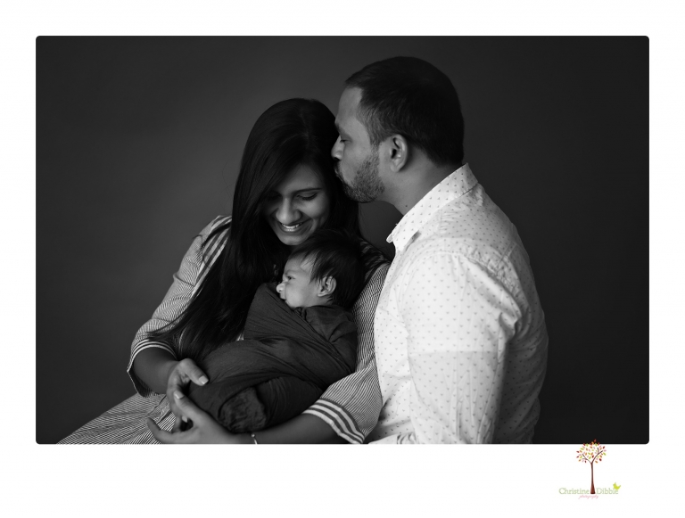 Sonora newborn photographer Christine Dibble Photography takes newborn family portraits of a baby boy and his parents and grandmother.