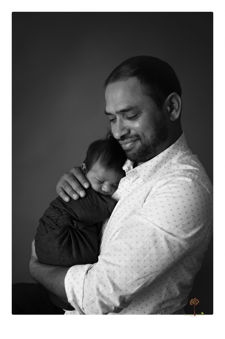 Sonora newborn photographer Christine Dibble Photography takes newborn family portraits of a baby boy and his parents and grandmother.