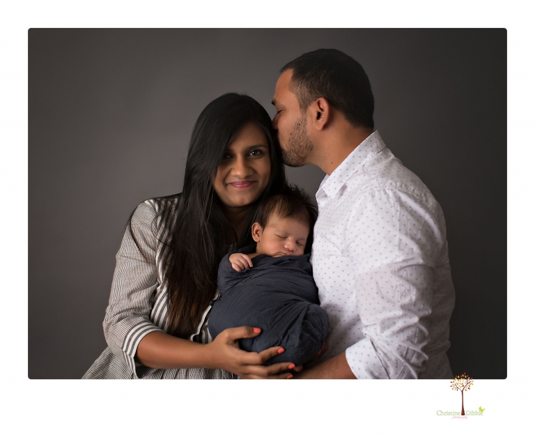 Sonora newborn photographer Christine Dibble Photography takes newborn family portraits of a baby boy and his parents and grandmother.