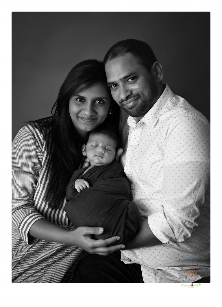 Sonora newborn photographer Christine Dibble Photography takes newborn family portraits of a baby boy and his parents and grandmother.