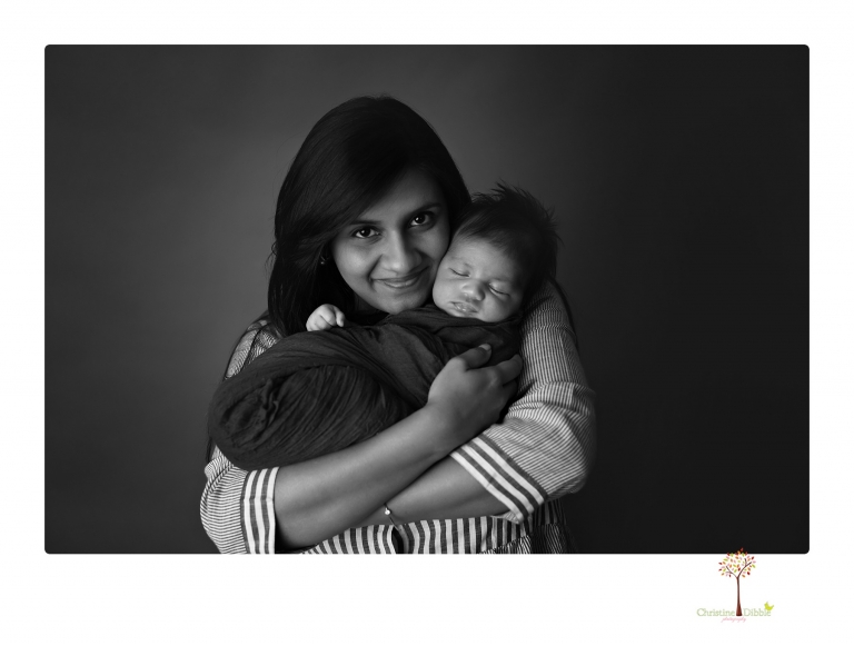 Sonora newborn photographer Christine Dibble Photography takes newborn family portraits of a baby boy and his parents and grandmother.