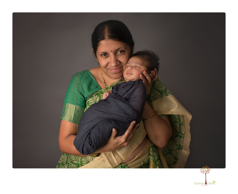 Sonora newborn photographer Christine Dibble Photography takes newborn family portraits of a baby boy and his parents and grandmother.