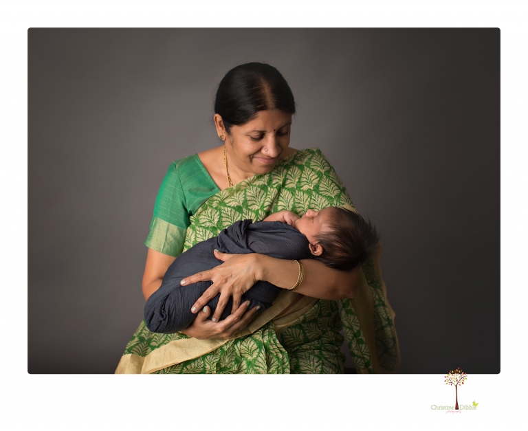 Sonora newborn photographer Christine Dibble Photography takes newborn family portraits of a baby boy and his parents and grandmother.