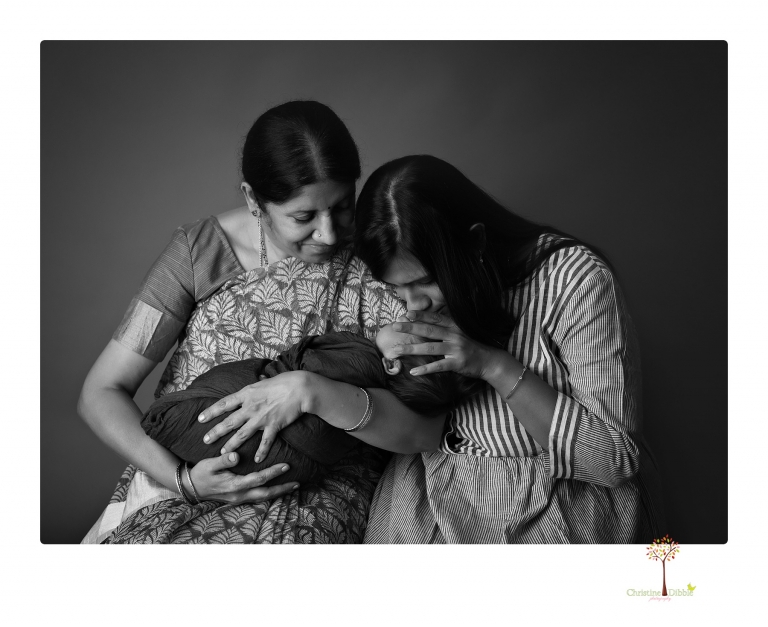 Sonora newborn photographer Christine Dibble Photography takes newborn family portraits of a baby boy and his parents and grandmother.