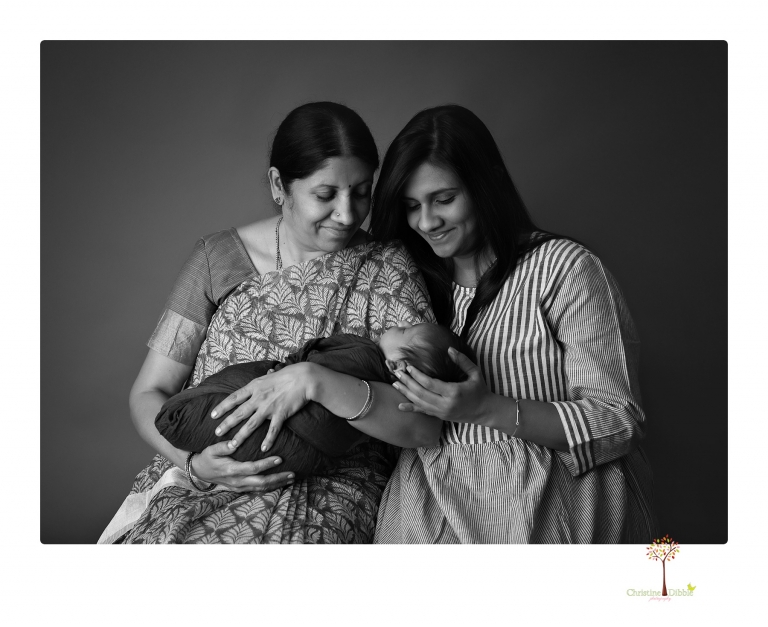 Sonora newborn photographer Christine Dibble Photography takes newborn family portraits of a baby boy and his parents and grandmother.